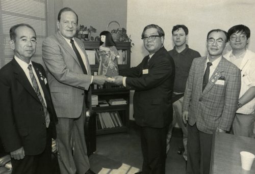 A meeting at Tyler City Hall on May 29, 1991, brought discussion about official Sister City twinning ceremonies and the possible hiring of instructors from Tyler who would teach English for a one year term in Yachiyo schools. Yachiyo mayor Hideo Tomioka, commented: “Tyler is a lively, bright town.” Left to right: Hiroshi Miyazaki, International Sister City committee member; Tyler Mayor Smith Reynolds; Yachiyo Mayor Tomioka; translator Ray Sullivan; Satoshi Okuyama, Yachiyo deputy chief of planning, and Junichiro Ohira, Yachiyo planning department staff member.