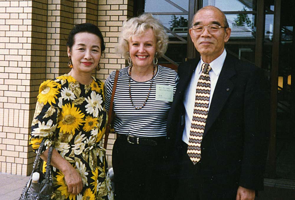 Mr. and Mrs. Sugo of Yachiyo, with Pat Johns, center
